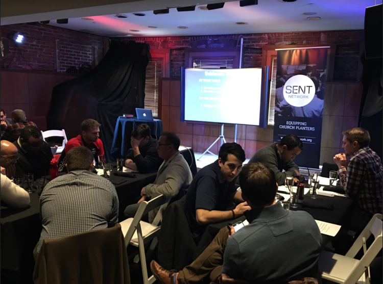 Church planters and pastors praying and encouraging one another at a monthly SENT Collective.