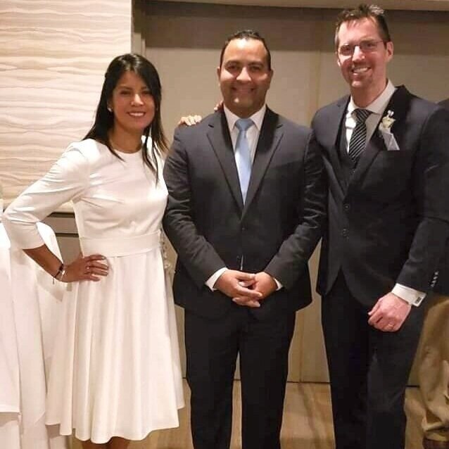 Jorge (center) married Candhy and Robert in February 2020